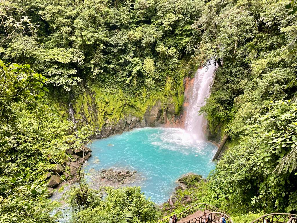 Rio Celeste waterfall in the middle of trees in Costa Rica.