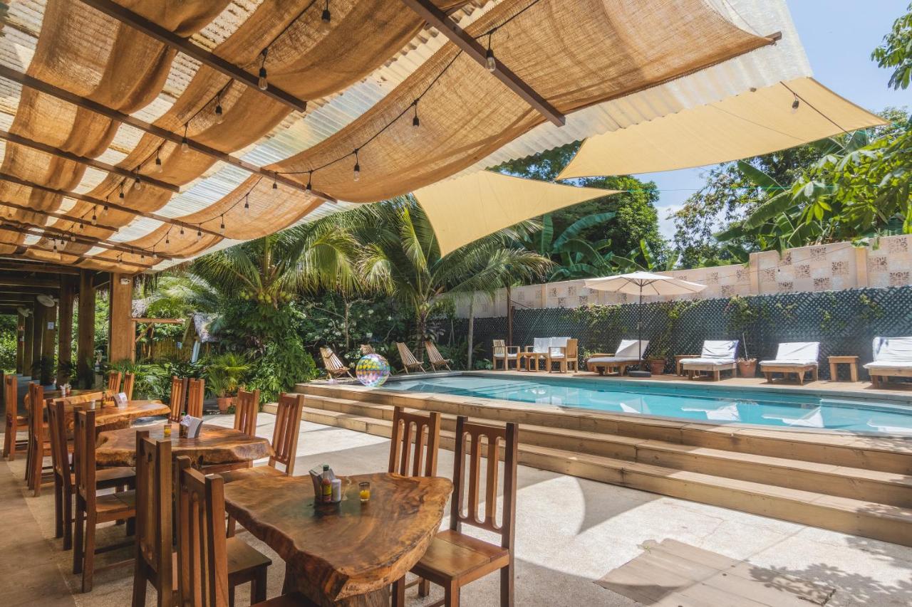 Outdoor dining area and pool at the Michanti Hotel for the El Salvador group trip.