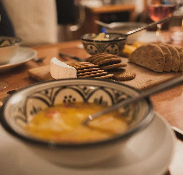 Fish soup and crackers in a saloon in Norway during a small group trip dinner.