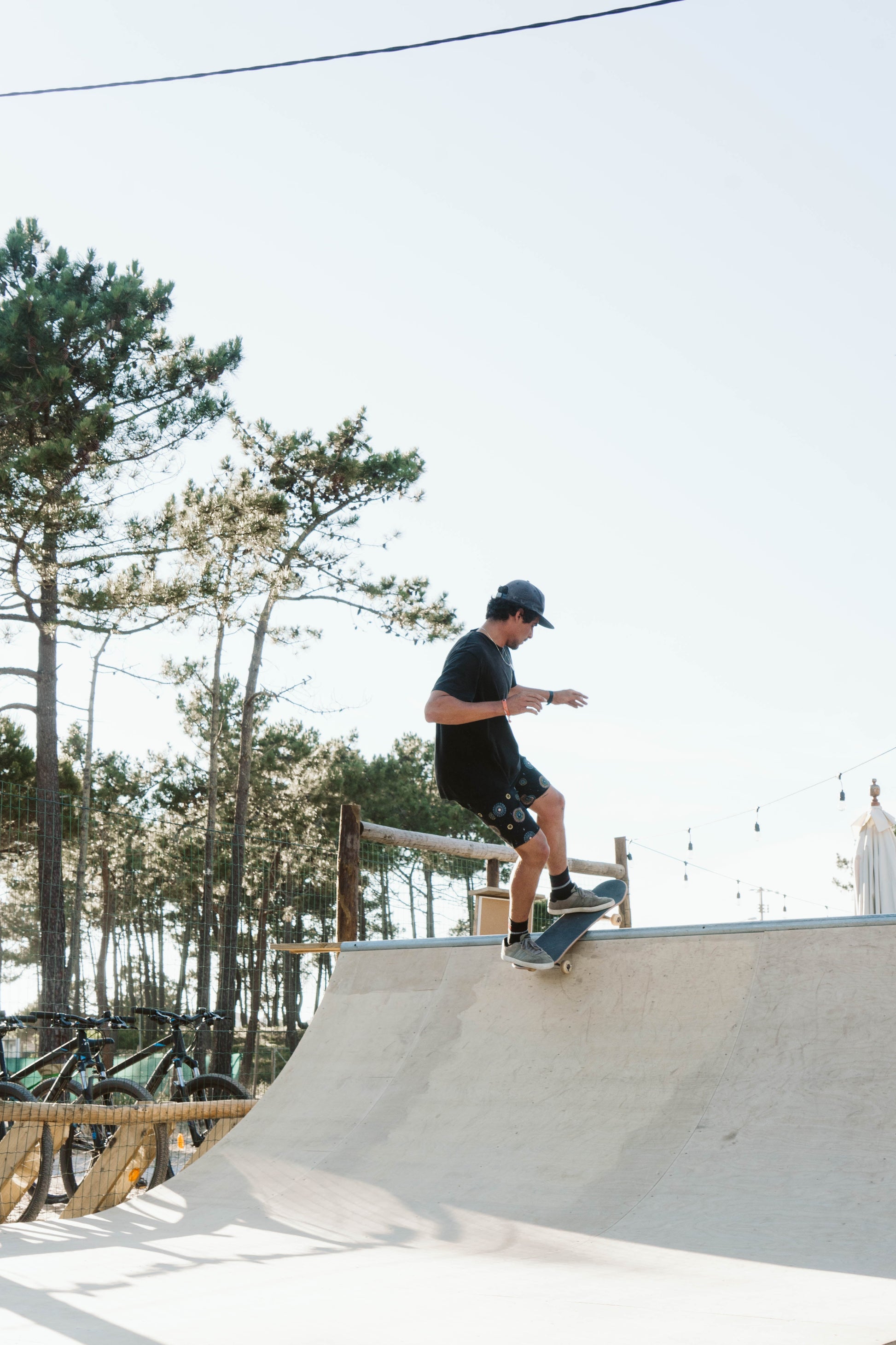 Guy skateboarding on a skate ramp in Praia da Tocha Portugal during a small group trip excursion.