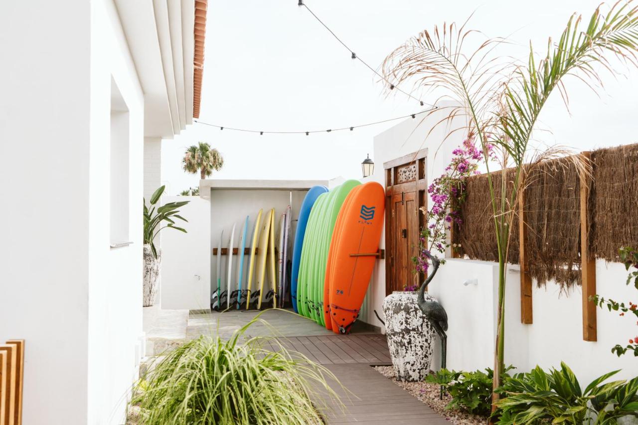 Stacked surf boards located outside of the Fuerteventura trip accommodation.