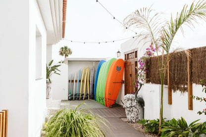 Stacked surf boards located outside of the Fuerteventura trip accommodation.
