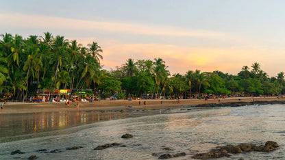 Tamarindo beach shoreline during the sunset.